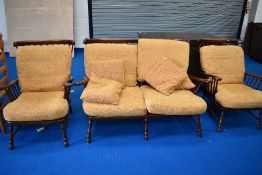 A nice quality reproduction oak cottage suite comprising spindle back settee and two chairs, with