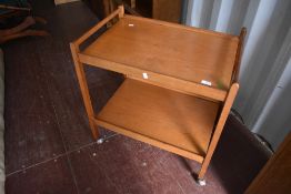 A vintage teak tea trolley