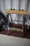 A f0oldable work bench, similar to Black and Decker workmate