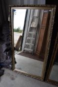 A gilt framed wall mirror, approx 133 x 71cm