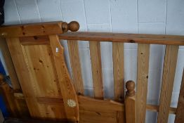 A modern pine double bed frame
