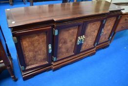 An Oriental breakfront sideboard, approx. 161cm wide