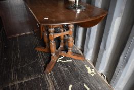 A mid to late 20th Century mid/dark stained Ercol or similar gateleg table