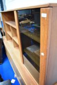A vintage teak sideboard with part glazed top section