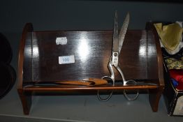 An early 20th century small wooden book trough having inlaid detail to sides, a pair of scissors and