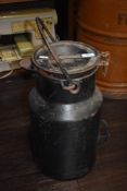 A vintage painted milk churn.