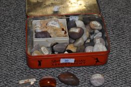 A selection of natural stone samples, including quartz and Amethyst.