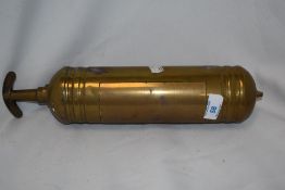 A vintage brass fire extinguisher 'The L & G'.
