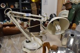 A vintage white Anglepoise desk lamp.