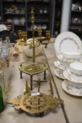 A selection of vintage brass, including candlestick, two snuffers and two trivets.