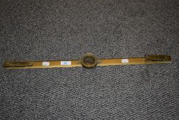 A vintage brass range finder.