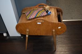 A 1960's/retro tambour topped sewing box, with sectioned lift-out trays to the interior, raised on