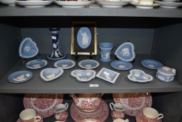 A collection of Wedgwood Jasperware pin dishes, trinket dish, vase, candlestick and similar.