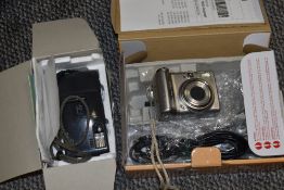 A AF-1 Olympus camera and and a Cannon power shot A70IS.