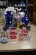 A mixed lot of vintage and antique glassware, including amethyst coloured glasses with etched