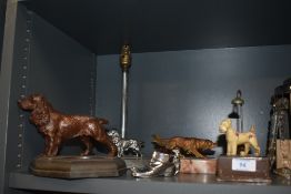 An Art Deco cast metal paperweight/pin dish, a lamp base, pen holder, pin cusion and similar, all of