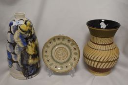 An studio pottery lamp base, of elongated oval form with short flared neck, decorated with