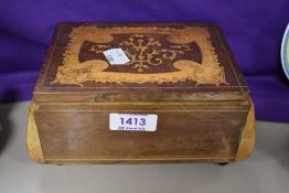 A 19th Century mahogany inlaid jewellery box with musical mechanism and compartmented interior, 8.