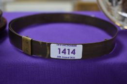 An antique milliners hat measuring device.