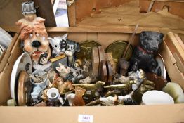 A collection of dog studies and all things dog including brass ware, books and decorative plates