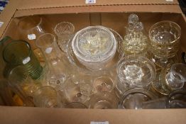 A selection of glass items including champagne glasses, desert dishes, crystal bowl and three