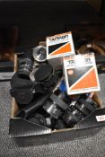 A box of approx twenty various tele-converters and extension tubes as well as several lens hoods