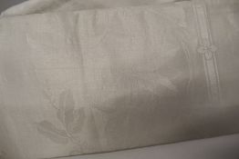 An assortment of antique and vintage damask and double damask table linen, some good sized