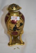 A French Beaux d'Art Limoges lidded vase, of ovoid form, gilt coloured, and decorated with birds and