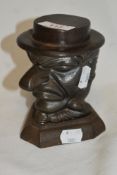 A 19th Century cast iron tobacco jar, modelled as a scowling gentleman, measuring 14cm tall