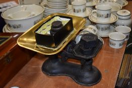 A set of cast iron weighing scales with weights