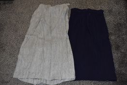 Three 1940s and 1950s skirts, including grey with colourful flecks and pleat to reverse with