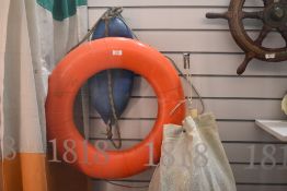 A vintage 24 Perry Buoy life ring and a buffer