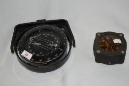 A Sowester Bosun gimballed ship's compass, 16cm in diameter, together with another marine compass