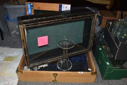 A 19th Century glass topped shop display cabinet, finished in black, with lined interior, 15cm x