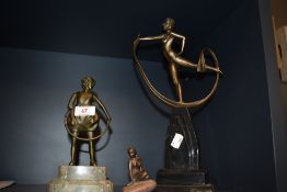 A bronze Art Deco style figural ornament, girl with hoop, raised on a stepped marble base, 21cm