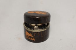 A small crocodile skin covered travelling ink well, diameter 5cm