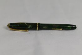 A Conway Stewart Dinkie 550 lever fill fountain pen in green marble with single band to the cap