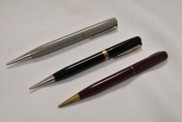 Three Waterman propelling pencils
