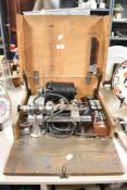 An early to mid-20th Century watch maker's lathe, housed within a stained pine case, 18cm x 41cm x