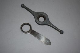 An original Rolex Number seven case tool, sold with a stainless steel Rolex case tool number one.