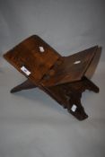 A primitive antique English, European or possibly Eastern oak book rest having carved Hexafoil