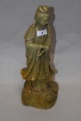 A 20th century Chinese carved green stone (possibly a varigated jade) figure of Qui Yen.