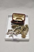 A late 19th/early 20th Century gold coloured crescent brooch set with diamantes, a Maltese Cross