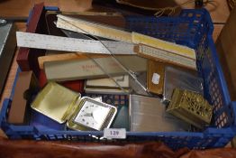 A miscellany of items to include wooden rules, cigarette cases, alarm clocks and card games.