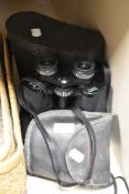Two sets of binoculars, one pair Prinzlux and the other unbranded.