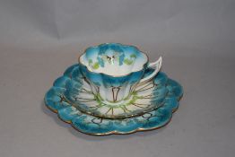 An Old Foley Shelley trio, having Art Nouveau plant design in teal, green and brown to white ground,