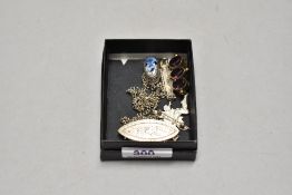 A small selection of silver and white metal jewellery, including fairy brooch