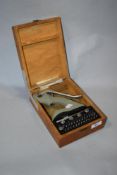 A vintage boxed jewellery press 'Favorite Ref 1097'.