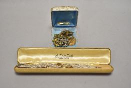An early 20th Century diamante and seed pearl style bracelet, a silver gilt and simulated pearl