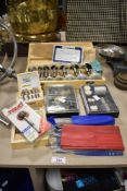 A small collection of woodworking tool accessories, to include Micro Router bits, and a drill bit